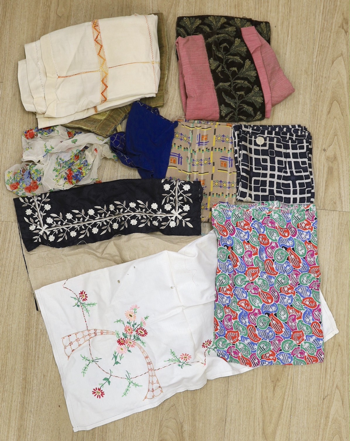 Various lengths of 1940's and later crepe, a large beaded edged cover and other fabrics, etc.